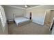 Bedroom with stylish furniture, plush carpet, and ensuite bathroom and closet provide privacy and convenience at 210 Magnolia Blvd, Pahrump, NV 89048