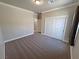 Bedroom with neutral carpet, closet, and a window at 210 Magnolia Blvd, Pahrump, NV 89048