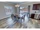 Bright dining room with a table, six chairs, and sliding doors to the backyard at 210 Magnolia Blvd, Pahrump, NV 89048