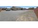 Exterior view showing an RV parked alongside the house within a large backyard at 210 Magnolia Blvd, Pahrump, NV 89048