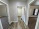 Hallway with access to multiple rooms and neutral wall paint at 210 Magnolia Blvd, Pahrump, NV 89048