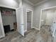 Hallway with storage and doorways to bedroom and laundry room at 210 Magnolia Blvd, Pahrump, NV 89048