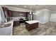 Stylish kitchen with stainless steel appliances, kitchen island, and modern lighting at 210 Magnolia Blvd, Pahrump, NV 89048