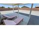 Covered patio featuring lounge chairs provides a perfect relaxation spot outdoors at 210 Magnolia Blvd, Pahrump, NV 89048