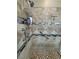Close-up on an elaborate shower design featuring niche shelving, and grab bars for comfort and safety at 210 Magnolia Blvd, Pahrump, NV 89048