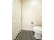 Powder room featuring modern fixtures and gray vinyl flooring, offering convenience and style for guests at 23 E Agate Ave # 308, Las Vegas, NV 89123