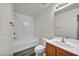 Clean, well-lit bathroom featuring a tub, a shower, a toilet and a single sink vanity at 23 E Agate Ave # 308, Las Vegas, NV 89123