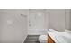 Full bathroom with a tub and shower combination, single vanity and modern fixtures at 23 E Agate Ave # 308, Las Vegas, NV 89123
