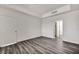 Bedroom with laminate floors and open doorway to a closet at 23 E Agate Ave # 308, Las Vegas, NV 89123