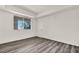 Bright bedroom featuring a window for natural light and plank flooring at 23 E Agate Ave # 308, Las Vegas, NV 89123