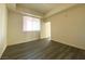 Well-lit bedroom with large windows and contemporary vinyl floors, creating a serene and comfortable atmosphere at 23 E Agate Ave # 308, Las Vegas, NV 89123