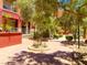 Landscaped courtyard with walking paths and mature trees, adds to the community's charm at 23 E Agate Ave # 308, Las Vegas, NV 89123