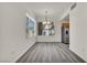Bright dining area with wood-look flooring, chandelier and natural light at 23 E Agate Ave # 308, Las Vegas, NV 89123