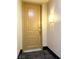 Condo unit door, number 308, in a secure building with black trim and gold hardware, offers privacy and safety at 23 E Agate Ave # 308, Las Vegas, NV 89123