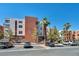 Multi-story condo building exterior with parking spaces in front at 23 E Agate Ave # 308, Las Vegas, NV 89123