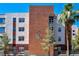 Close-up exterior view of multi-story condominium building with clearly marked unit numbers at 23 E Agate Ave # 308, Las Vegas, NV 89123