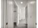Hallway that leads to a full bath and bedroom, showcasing the layout of the home at 23 E Agate Ave # 308, Las Vegas, NV 89123