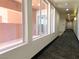Well-lit condo hallway with carpet, recessed lighting and neutral walls, provides access to all units at 23 E Agate Ave # 308, Las Vegas, NV 89123
