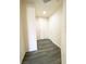 Inviting entryway featuring modern gray vinyl flooring, a front door and a coat closet for convenience and style at 23 E Agate Ave # 308, Las Vegas, NV 89123
