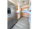 Well-lit kitchen featuring stainless steel appliances, granite countertops, and light wood cabinets at 23 E Agate Ave # 308, Las Vegas, NV 89123