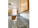 Spacious kitchen with granite countertops, stainless sink, and white appliances is move-in ready at 23 E Agate Ave # 308, Las Vegas, NV 89123