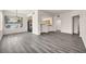 Open concept living room with kitchen features and window views at 23 E Agate Ave # 308, Las Vegas, NV 89123