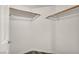 Spacious walk-in closet with ample shelving and wood flooring at 23 E Agate Ave # 308, Las Vegas, NV 89123