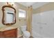 Bathroom featuring vanity with decorative mirror, toilet, and shower with curtain at 2825 Brianwood Ct, Las Vegas, NV 89134