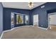 Blue bedroom featuring a bay window and an ensuite bathroom at 2825 Brianwood Ct, Las Vegas, NV 89134