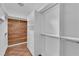 Walk-in closet with custom white shelving and built in drawers for optimal storage at 2825 Brianwood Ct, Las Vegas, NV 89134