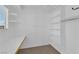 Empty walk-in closet with natural light, shelving and closet rod; ready to be customized at 2825 Brianwood Ct, Las Vegas, NV 89134