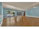 Expansive living space features sleek hardwood floors and large glass doors that open to the pool and yard at 2825 Brianwood Ct, Las Vegas, NV 89134