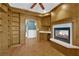 Cozy living room featuring a fireplace with a marble hearth and built in storage shelves at 2825 Brianwood Ct, Las Vegas, NV 89134