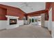Cozy main bedroom with a fireplace, ceiling fan and a sliding door to the outdoors at 2825 Brianwood Ct, Las Vegas, NV 89134