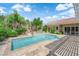 Gorgeous backyard pool area with lush landscaping, patio and desert landscaping at 2825 Brianwood Ct, Las Vegas, NV 89134