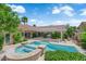 Backyard view of a pool, spa, patio and desert landscaping at 2825 Brianwood Ct, Las Vegas, NV 89134