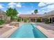 Backyard featuring a pool, spa, mature trees and desert landscaping at 2825 Brianwood Ct, Las Vegas, NV 89134