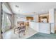 Cozy breakfast area with adjacent kitchen featuring light-colored walls and a large window at 3050 Canal Walk Rd, Henderson, NV 89052