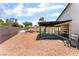 This backyard offers a patio, stone fire pit, rock landscaping and artificial turf, blending relaxation and convenience at 3086 Cardinal Dr, Las Vegas, NV 89121