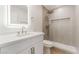 Modern bathroom with white vanity, lighted mirror, and walk-in shower at 3086 Cardinal Dr, Las Vegas, NV 89121