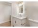 Bright bathroom features illuminated mirror, quartz counters, and modern gold fixtures at 3086 Cardinal Dr, Las Vegas, NV 89121