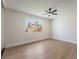 Bright and airy bedroom with a large window and wood floors at 3086 Cardinal Dr, Las Vegas, NV 89121