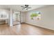Bedroom with a large window, wood floors, ceiling fan, and a vanity area at 3086 Cardinal Dr, Las Vegas, NV 89121