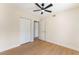 Light-filled bedroom features wood-look floors and closet with folding doors at 3086 Cardinal Dr, Las Vegas, NV 89121