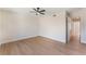 Spacious bedroom with a ceiling fan, wood floors, and view to hallway at 3086 Cardinal Dr, Las Vegas, NV 89121