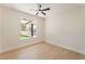 Bright bedroom featuring wood-look floors, ceiling fan, and ample natural light at 3086 Cardinal Dr, Las Vegas, NV 89121