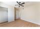 Bright bedroom featuring wood-look floors and closet with sliding doors at 3086 Cardinal Dr, Las Vegas, NV 89121
