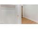 Walk-in closet with built in shelving and wood floors with an adjacent room at 3086 Cardinal Dr, Las Vegas, NV 89121