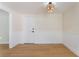 Bright dining room with light wood flooring, wainscoting, and stylish light fixture at 3086 Cardinal Dr, Las Vegas, NV 89121