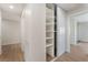 Hallway featuring closet with shelving and sliding door, and access to other rooms at 3086 Cardinal Dr, Las Vegas, NV 89121